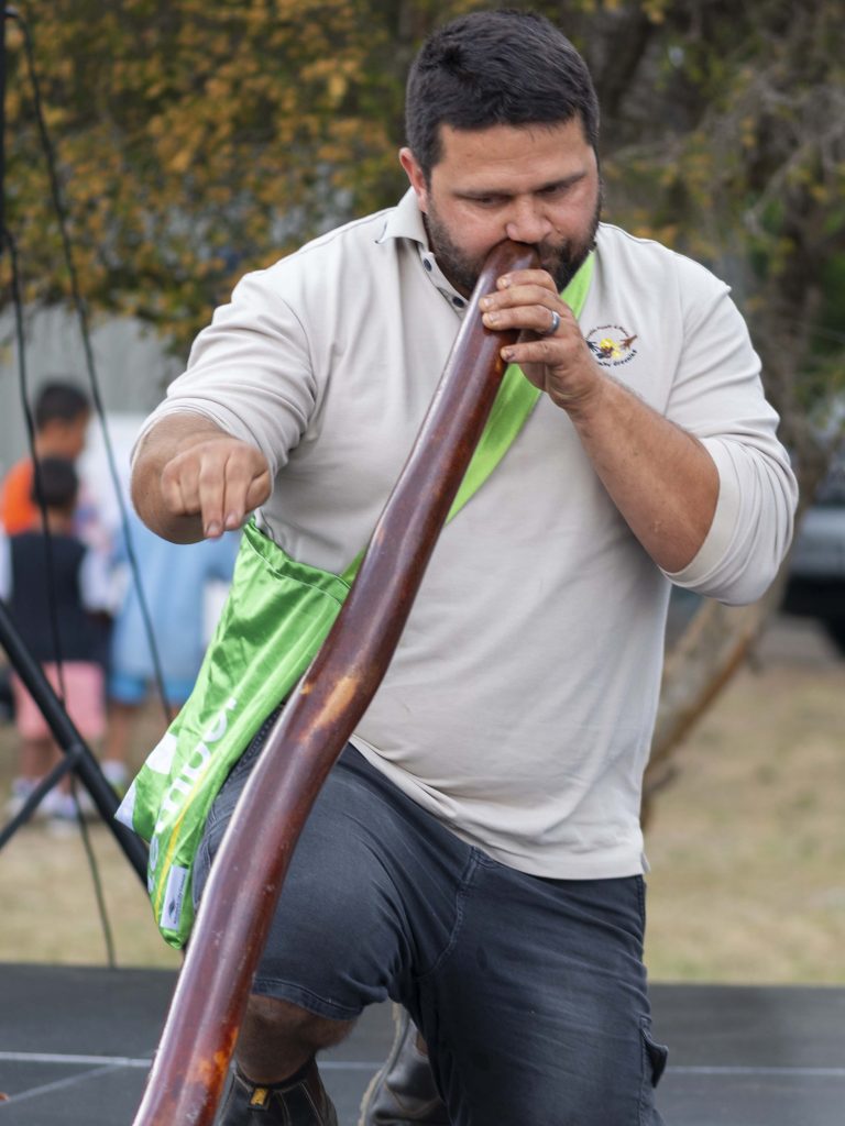 Photo of Brendan from Royal Botanic Gardens playing didgeridoo at 10th Family Fun Day
